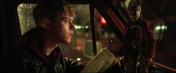 Movie still from “Metallica Through the Never” (2013), directed by Nimród Antal – A man sitting in the driver's seat of a car; Close Up shot, Over the shoulder angle