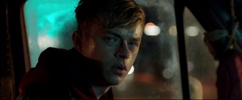 Movie still from “Metallica Through the Never” (2013), directed by Nimród Antal – A person wearing a jacket; Close Up shot, Over the shoulder angle