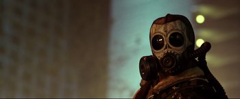 Movie still from “Metallica Through the Never” (2013), directed by Nimród Antal – A person with a gas mask on in the dark; Close Up shot, Low angle