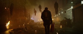 Movie still from “Metallica Through the Never” (2013), directed by Nimród Antal – A man walking down a street at night with lots of smoke; Wide shot, Low angle