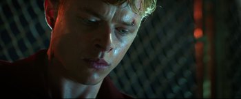 Movie still from “Metallica Through the Never” (2013), directed by Nimród Antal – A young man's face with blood on his face; Close Up shot, Low angle