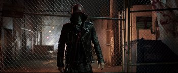 Movie still from “Metallica Through the Never” (2013), directed by Nimród Antal – A man in a leather jacket and a red hood; Medium shot, Low angle