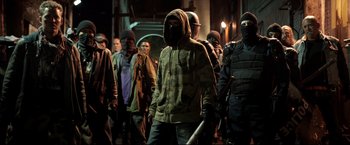 Movie still from “Metallica Through the Never” (2013), directed by Nimród Antal – A group of people in a dark alley; Medium shot, Low angle