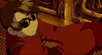 Movie still from “Metropolis” (2001), directed by Rintarô – A person wearing a red shirt; Close Up shot, Low angle