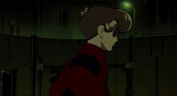 Movie still from “Metropolis” (2001), directed by Rintarô – A man in a red jacket standing in front of a green light; Close Up shot, Low angle