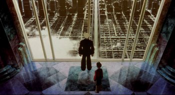 Movie still from “Metropolis” (2001), directed by Rintarô – A boy standing in front of a window looking at a giant teddy bear; Extreme Wide shot, Low angle