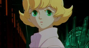 Movie still from “Metropolis” (2001), directed by Rintarô – A person with green eyes and blonde hair; Close Up shot, Low angle