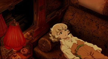 Movie still from “Metropolis” (2001), directed by Rintarô – A young child laying on a couch in a room; Medium shot, High angle
