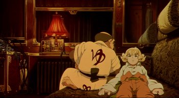 Movie still from “Metropolis” (2001), directed by Rintarô – A couple of people sitting on top of a bed; Medium shot, High angle