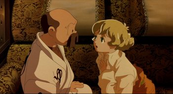 Movie still from “Metropolis” (2001), directed by Rintarô – An old man and a young girl are talking to each other; Close Up shot, High angle