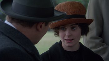Movie still from “Michael Collins” (1996), directed by Neil Jordan – A man and a woman wearing a hat; Close Up shot, Over the shoulder angle