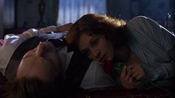 Movie still from “Michael Collins” (1996), directed by Neil Jordan – A man and a woman laying on a bed; Close Up shot, High angle