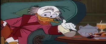 Movie still from “Mickey and the Beanstalk” (1947), directed by Hamilton Luske – A cartoon character sitting in a chair; Medium shot, High angle