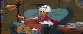 Movie still from “Mickey and the Beanstalk” (1947), directed by Hamilton Luske – A duck sitting on top of a couch while reading a book; Medium shot, Low angle