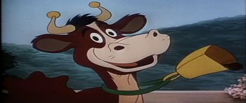 Movie still from “Mickey and the Beanstalk” (1947), directed by Hamilton Luske – A cartoon of a cow with a leash around its neck; Extreme Close Up shot, Low angle