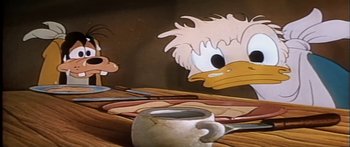Movie still from “Mickey and the Beanstalk” (1947), directed by Hamilton Luske – A coffee cup in front of a painting of donald duck; Close Up shot, Low angle