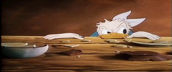 Movie still from “Mickey and the Beanstalk” (1947), directed by Hamilton Luske – A cartoon character's face on a wooden table; Close Up shot, High angle