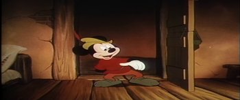 Movie still from “Mickey and the Beanstalk” (1947), directed by Hamilton Luske – A mickey mouse cartoon character is standing in front of a door; Medium shot, Low angle