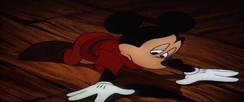 Movie still from “Mickey and the Beanstalk” (1947), directed by Hamilton Luske – A mickey mouse cartoon character with a red scarf; Medium shot, Low angle