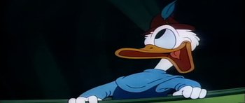 Movie still from “Mickey and the Beanstalk” (1947), directed by Hamilton Luske – A cartoon duck's face; Extreme Close Up shot, Low angle