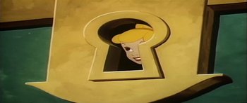 Movie still from “Mickey and the Beanstalk” (1947), directed by Hamilton Luske – A picture of a key hole with a picture of a woman's face in it; Extreme Close Up shot, High angle