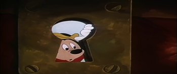 Movie still from “Mickey and the Beanstalk” (1947), directed by Hamilton Luske – A goofy keyhole is shown in a cartoon; Close Up shot, High angle
