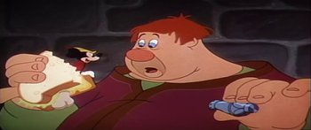 Movie still from “Mickey and the Beanstalk” (1947), directed by Hamilton Luske – A cartoon character with a goofy look on his face; Medium shot, Low angle