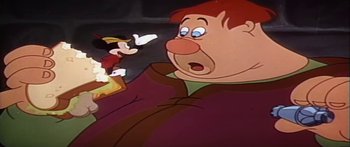 Movie still from “Mickey and the Beanstalk” (1947), directed by Hamilton Luske – A cartoon of a man with a goofy look on his face; Medium shot, Low angle