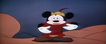 Movie still from “Mickey and the Beanstalk” (1947), directed by Hamilton Luske – A mickey mouse cartoon character with his arms outstreched; Medium shot, Low angle