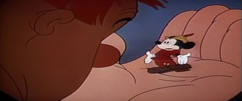 Movie still from “Mickey and the Beanstalk” (1947), directed by Hamilton Luske – A goofy cartoon character looking at another cartoon character; Extreme Close Up shot, Low angle