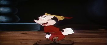 Movie still from “Mickey and the Beanstalk” (1947), directed by Hamilton Luske – A goofy cartoon character is standing in front of a black background; Medium shot, Low angle