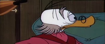 Movie still from “Mickey and the Beanstalk” (1947), directed by Hamilton Luske – A cartoon of a bird sitting on top of a chair; Extreme Close Up shot, Low angle