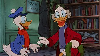 Movie still from “Mickey's Christmas Carol” (1983), directed by Burny Mattinson – A couple of people that are sitting down in a room; Medium shot, Over the shoulder angle