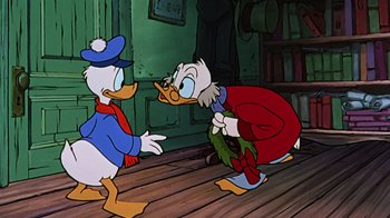Movie still from “Mickey's Christmas Carol” (1983), directed by Burny Mattinson – Two cartoon characters one of which is dressed in a red suit and the other is dressed in a blue suit and a blue hat; Medium shot, Over the shoulder angle