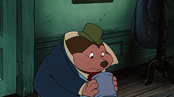 Movie still from “Mickey's Christmas Carol” (1983), directed by Burny Mattinson – A cartoon of a bear wearing a hat and holding a cup; Close Up shot, High angle