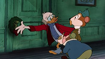 Movie still from “Mickey's Christmas Carol” (1983), directed by Burny Mattinson – A man in a red jacket and a duck in a red jacket; Medium shot, Over the shoulder angle