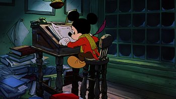 Movie still from “Mickey's Christmas Carol” (1983), directed by Burny Mattinson – A mickey mouse sitting at a desk reading a sheet of paper; Wide shot, High angle