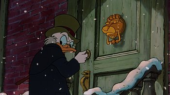 Movie still from “Mickey's Christmas Carol” (1983), directed by Burny Mattinson – Scrooge mcduck is looking through the door knob; Close Up shot, Over the shoulder angle