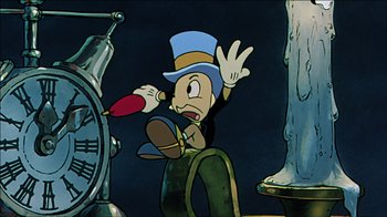Movie still from “Mickey's Christmas Carol” (1983), directed by Burny Mattinson – A cartoon of a goofy character with an arrow in his mouth; Medium shot, Low angle