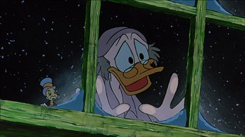 Movie still from “Mickey's Christmas Carol” (1983), directed by Burny Mattinson – A cartoon picture of a duck looking out of a window; Medium shot, Low angle