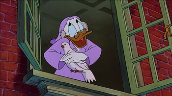 Movie still from “Mickey's Christmas Carol” (1983), directed by Burny Mattinson – A cartoon of scrooge mcduck holding a white pigeon; Medium shot, Low angle