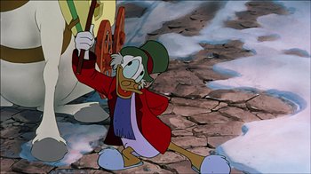 Movie still from “Mickey's Christmas Carol” (1983), directed by Burny Mattinson – A cartoon of scrooge mcduck holding a steering wheel; Medium shot, Low angle