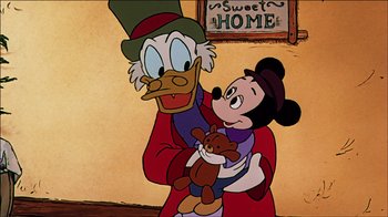 Movie still from “Mickey's Christmas Carol” (1983), directed by Burny Mattinson – A cartoon of mickey mouse and scrooge mcduck holding a teddy bear; Medium shot, Low angle