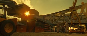 Movie still from “Micmacs” (2009), directed by Jean-Pierre Jeunet – A group of people standing next to each other on a bridge; Extreme Wide shot, Low angle