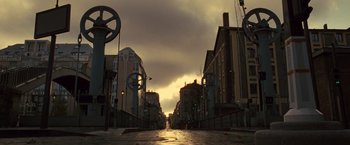 Movie still from “Micmacs” (2009), directed by Jean-Pierre Jeunet – A view of an empty street in a city; Extreme Wide shot, Low angle