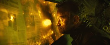 Movie still from “Micmacs” (2009), directed by Jean-Pierre Jeunet – A person looking at a wall; Close Up shot, Low angle