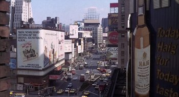 Movie still from “Midnight Cowboy” (1969), directed by John Schlesinger – A busy city street filled with lots of traffic; Extreme Wide shot, High angle