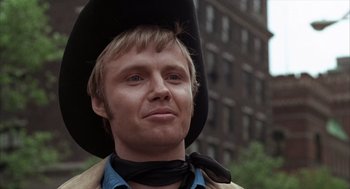 Movie still from “Midnight Cowboy” (1969), directed by John Schlesinger – A person wearing a cowboy hat; Close Up shot, Low angle