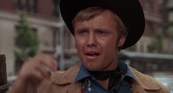 Movie still from “Midnight Cowboy” (1969), directed by John Schlesinger – A person wearing a cowboy hat; Close Up shot, Low angle