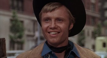 Movie still from “Midnight Cowboy” (1969), directed by John Schlesinger – A person wearing a cowboy hat; Close Up shot, Low angle